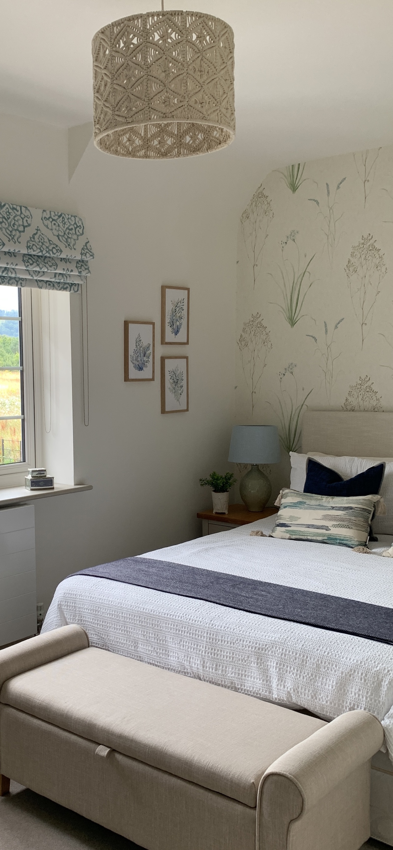 Botanical bedroom with macrame pendant and gallery wall