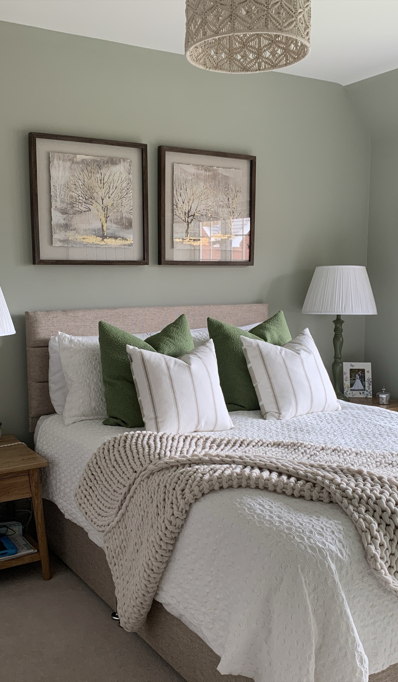 Design consultation — sage green bedroom with considered colour palette and layered textiles