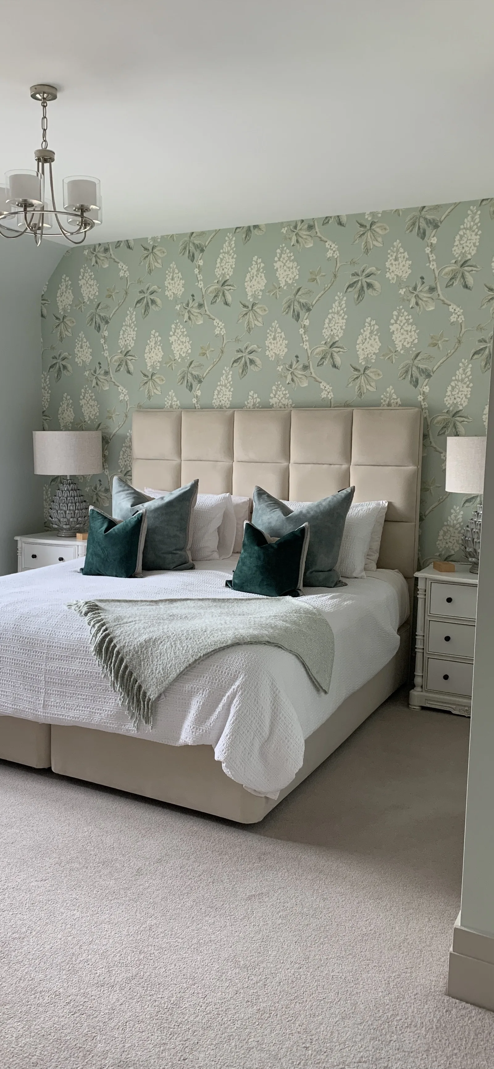 Character New Build - Thatched Cottage — bedroom with teal velvet cushions, botanical wallpaper, and symmetrical styling